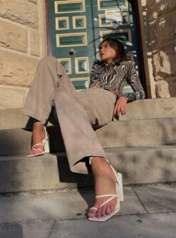 Motel Ryals Top 70's Ripple -Princess Polly Shop MOTEL PARALLEL JEANS BURNT OLIVE MOTEL RYALS TOP 70 S RIPPLE BILLINI CHEYANNE HEELS BONE eb06c45f 09e8 4e2b bf9e df8895b751e7